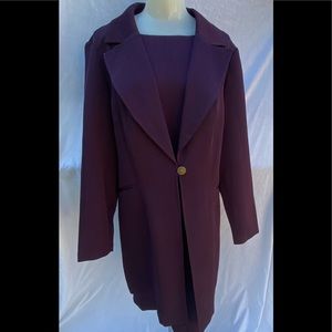 Two piece woman’s dark purple dress with jacket